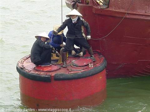 Workers on a buoy in Halong Bay