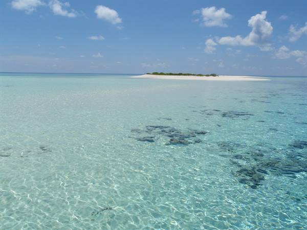 a sandbar in the middle of the ocean