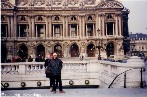 Tourist in front of the Opéra Garnier facade, Paris