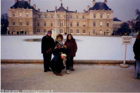 Group of tourists in front of the frozen fountain at Luxembourg Palace, Paris
