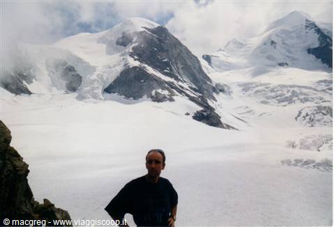Hiking on the glacier, snowy peaks in the mist