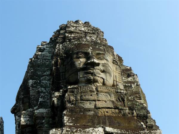 Carved stone face on a Bayon tower, Angkor Thom