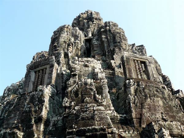Stone towers carved with giant faces at the Bayon temple, Angkor