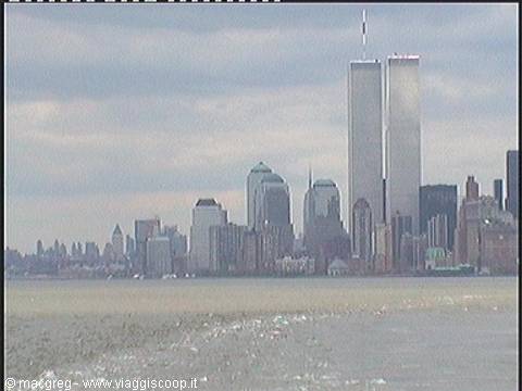 The Twin Towers of New York seen from the water under cloudy skies