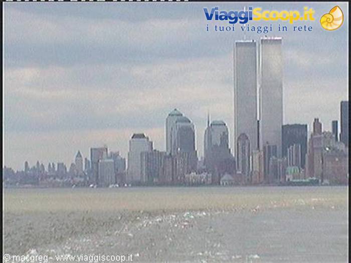 The Twin Towers of New York seen from the water under cloudy skies