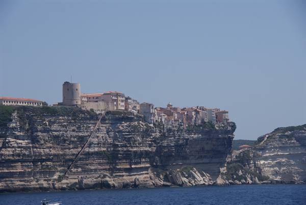 Bonifacio: houses and citadel atop layered limestone cliffs above the sea
