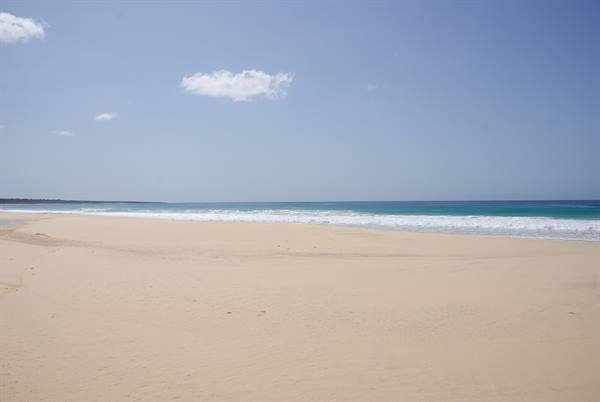 Golden sand and white waves on Costa Calma beach