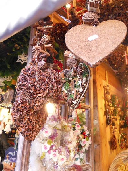 Star anise and cinnamon hearts hanging at a Christmas market stall
