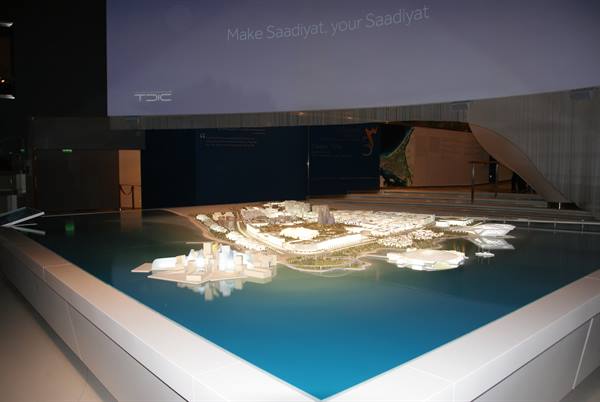 Illuminated architectural scale model of Saadiyat Island in exhibition hall
