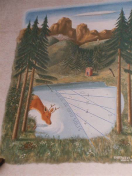 Painting on paper: deer drinking from a sundial lake, pines and small cabin