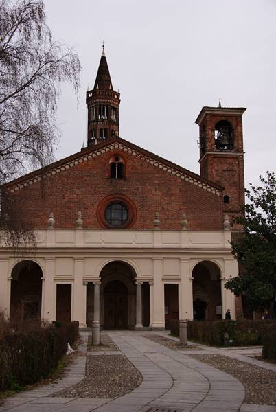 Brick facade with porch and two bell towers, Sant'Eustorgio Basilica in Milan