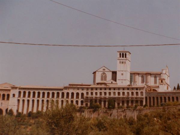The Basilica of San Francesco in Assisi with long arcades and bell tower