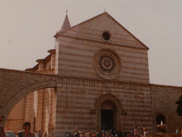 Santa Maria degli Angeli basilica in Assisi, brick facade with rose window