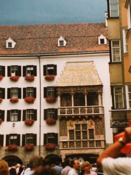 The Golden Roof in Innsbruck, gilded bay window above a flower-decorated facade