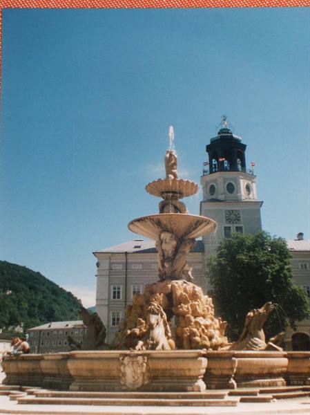 Baroque marble fountain with seahorses, Residenzplatz, Salzburg, clear blue sky