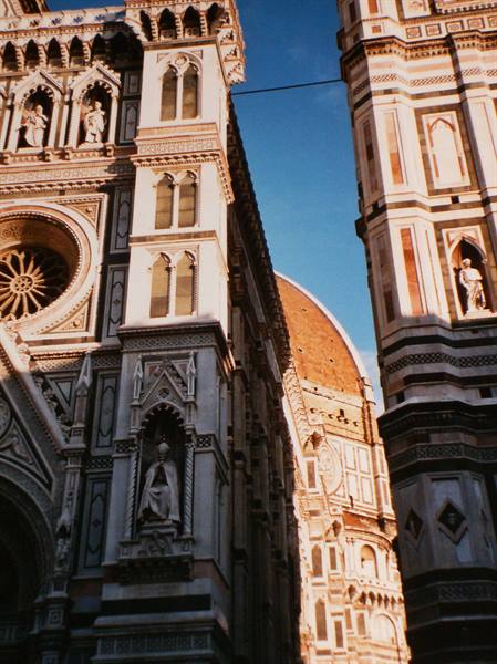 Florence Cathedral: white and green marble facade, brick dome under sunlight