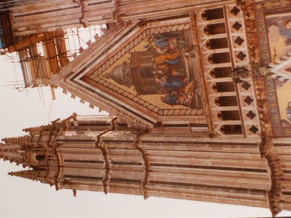 Orvieto Cathedral facade with golden mosaics and marble spire