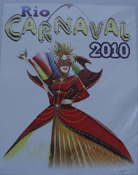 Rio Carnaval 2010 poster, dancer in red gown holding a colorful flag