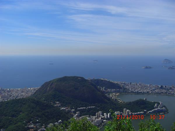 Rio de Janeiro: green hill, lagoon and highrises facing the blue ocean