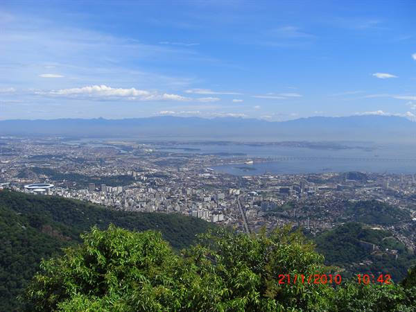 Rio de Janeiro seen from Corcovado: city, bay and bridge under blue sky