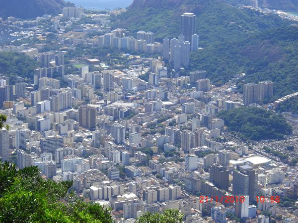 Rio de Janeiro skyscrapers among green hills, seen from above