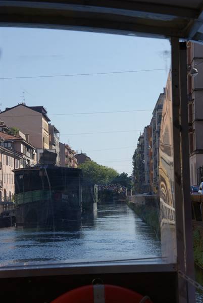 Naviglio Grande canal in Milan, houses along the water seen from boat