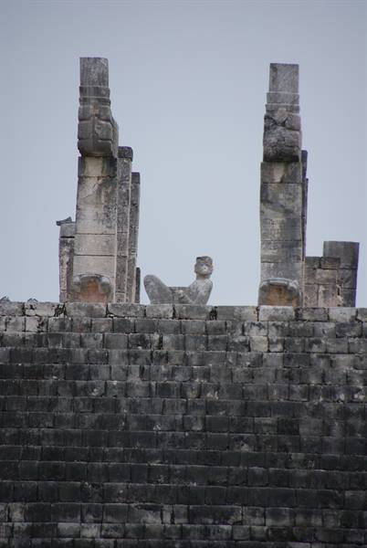 Chac Mool statue between stone columns atop Chichén Itzá temple