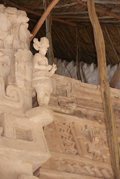 Stucco Maya warrior figure under thatched shelter, Ek Balam