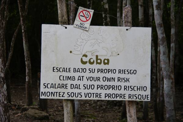 Wooden sign at Coba: no smoking, climbing at your own risk