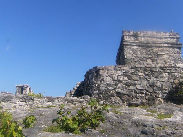 Mayan ruins at Tulum, dry stone walls under a clear blue sky