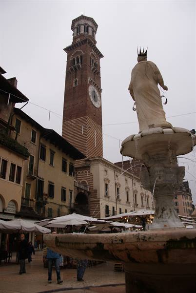 Verona, Madonna Verona fountain and Lamberti Tower over Piazza delle Erbe