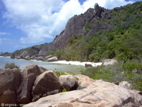 Granite boulders, white sand beach and tropical greenery at Grand Anse