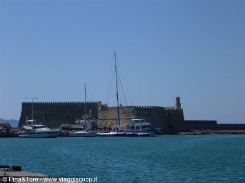 Fishing boats in front of the Venetian Koules fortress at Heraklion harbor