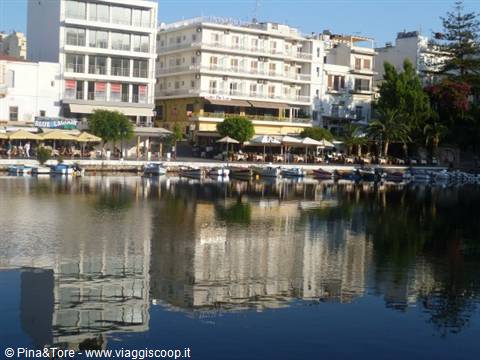 Lake Voulismeni in Agios Nikolaos, hotels and cafes reflected in the water