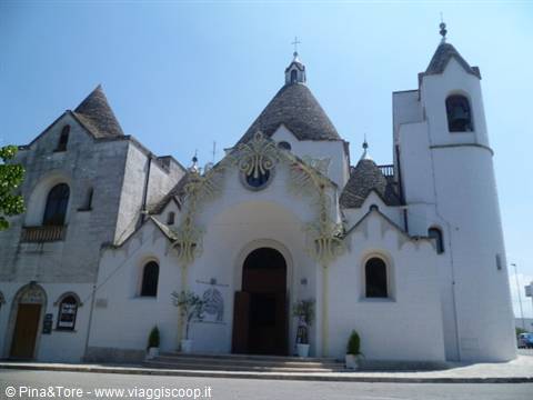 Church of Sant'Antonio in Alberobello, white facade with trullo dome roof