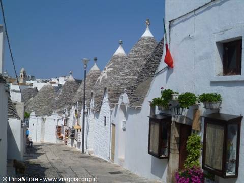 Trulli houses of Alberobello, whitewashed stone dwellings with conical roofs, in sunlight