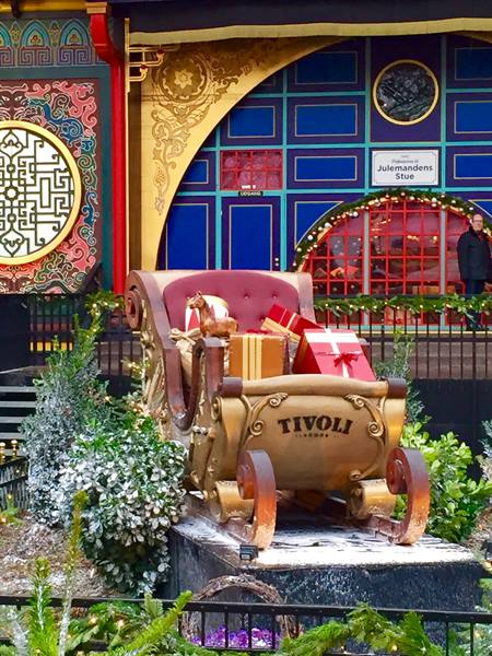 Golden Christmas sleigh with gifts labeled Tivoli, Tivoli Gardens Copenhagen