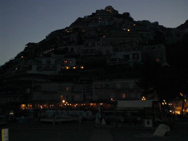 Positano at night, lit windows among hillside houses