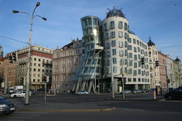 Prague's Dancing House, glass and concrete building, busy urban intersection