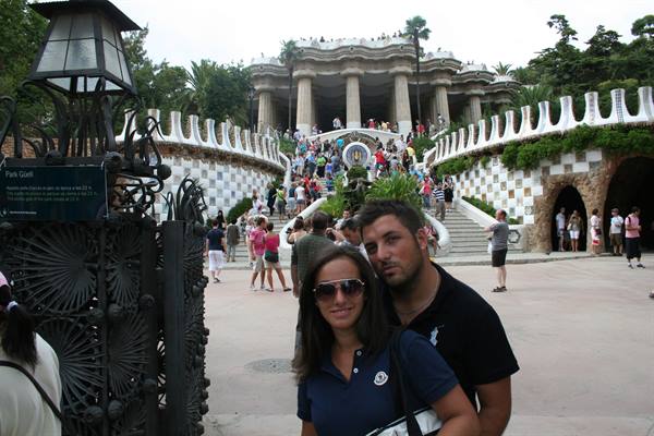 Couple in front of the mosaic staircase at Parc Güell