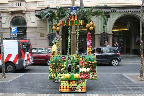 Fruit cart decorated with palm trees, Barcelona 2010 sign, on La Rambla