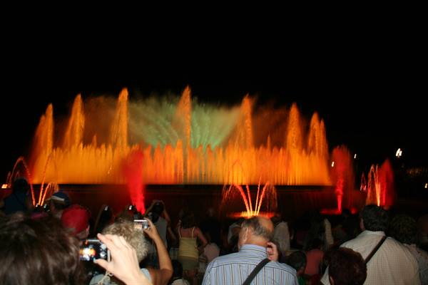 Magic Fountain of Montjuïc in Barcelona, colorful water jets at night before the crowd