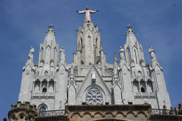Bronze Christ atop the Templo del Sagrat Cor spire on Mount Tibidabo