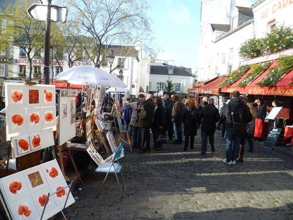 Painters displaying poppy watercolors at Place du Tertre in Montmartre