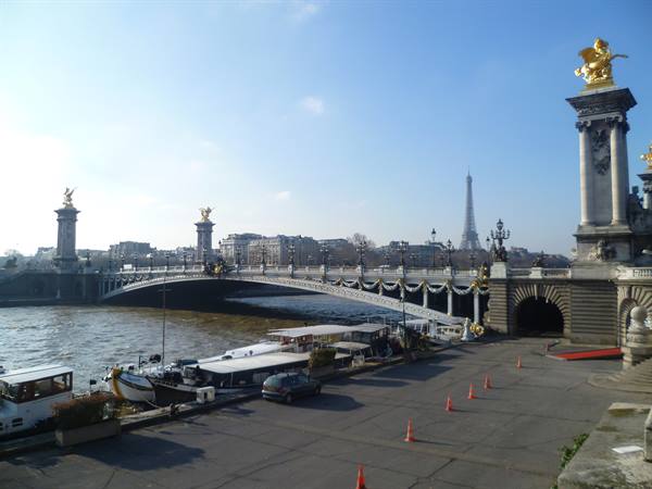 Pont Alexandre III over the Seine in Paris, moored boats, Eiffel Tower behind