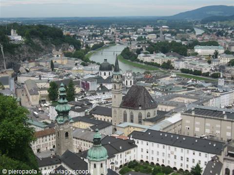 Salzburg: grey rooftops, green domes and the Salzach river among buildings