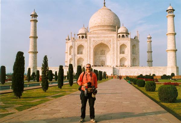 Tourist with camera on the Taj Mahal walkway, Agra