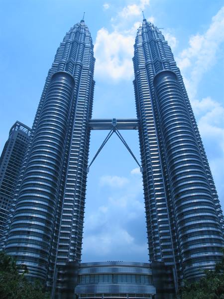 The Petronas Towers in Kuala Lumpur, steel and glass against a blue sky