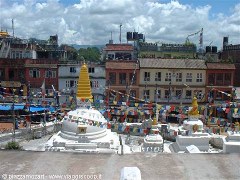White stupas with golden spire among prayer flags, Kathmandu
