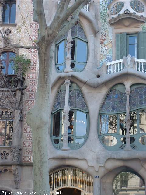 Undulating facade of Casa Batlló in Barcelona with Gaudí's stained glass and bone-like columns